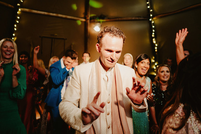 Groom dancing alone on the dancefloor during Kent's wedding reception