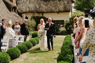 Father of the bride walking his daughter down the aisle at Marleybrook House