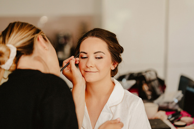 Beautiful Bride having her make up applied in natural light
