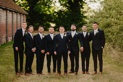 at the nightyard colourful groomsmen formal portrait outdoors