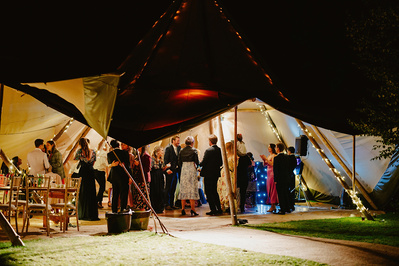 Night time during a wedding reception outdoors in a garden in Kent