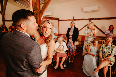 bride and groom laughing during the first dance at winters barns