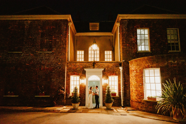 Lowlight Knight Portrait out in front of the Pelham house wedding venue giving off La La Land vibes