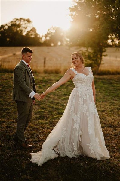 bride and groom dancing outside during sunset at silchester farm