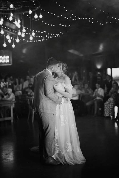 black and white photo of couple kissing during their first dance at silchester farm