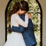 wedding embrace after the first kiss at kent wedding venue eastwell manor