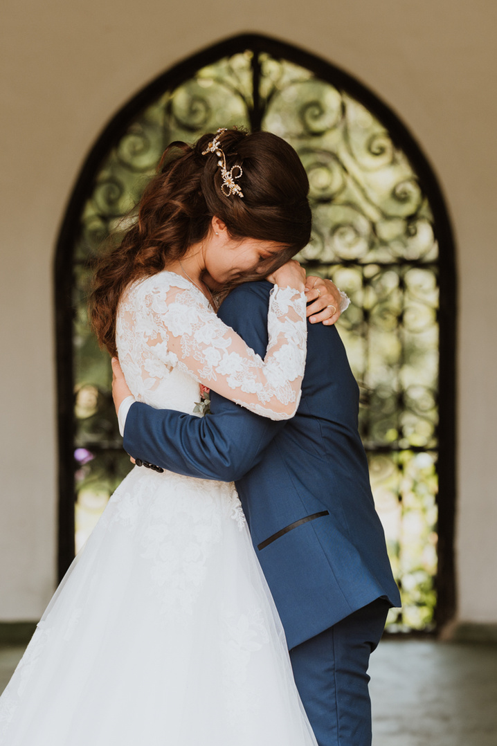 wedding embrace after the first kiss at kent wedding venue eastwell manor
