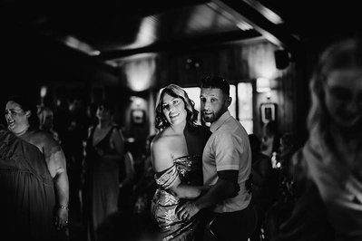 black and white photo of couple dancing at wedding in the new barn at silchester farm