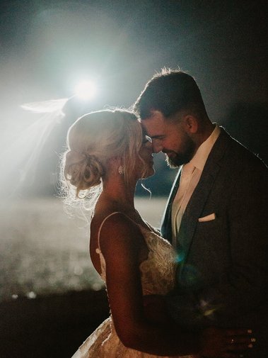 low light wedding photography portrait using a car park floodlight