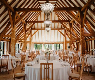 The amazing wedding venue  Kent barn reception area with large windows allowing amazing at natural light to come in