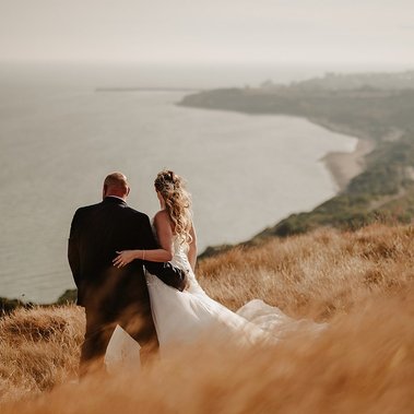 epic wedding portrait from behind on dover cliffs