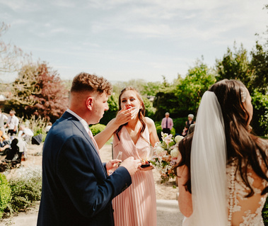 Bridesmaid caught putting food in her mouth