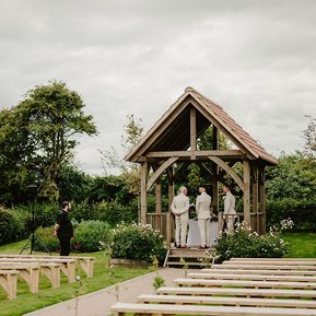 the outdoor ceremony area in the garden of kent wedding venue reach court farm weddings