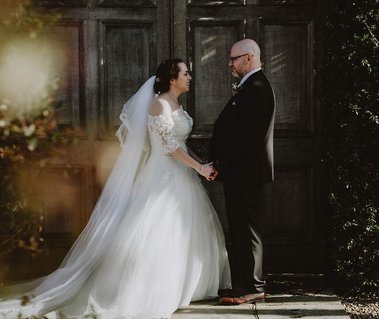 bride and groom gaze into each others eyes lovingly at the winters barns captured perfectly by kent wedding photographer