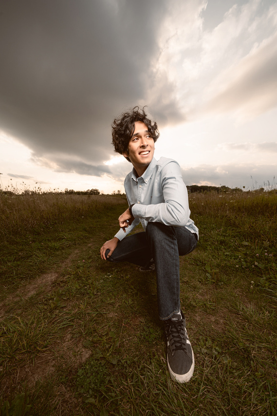Ultra wide angle portrait of a young high school boy. Stunning portrait shot in Mequon Nature Preserve Wisconsin.