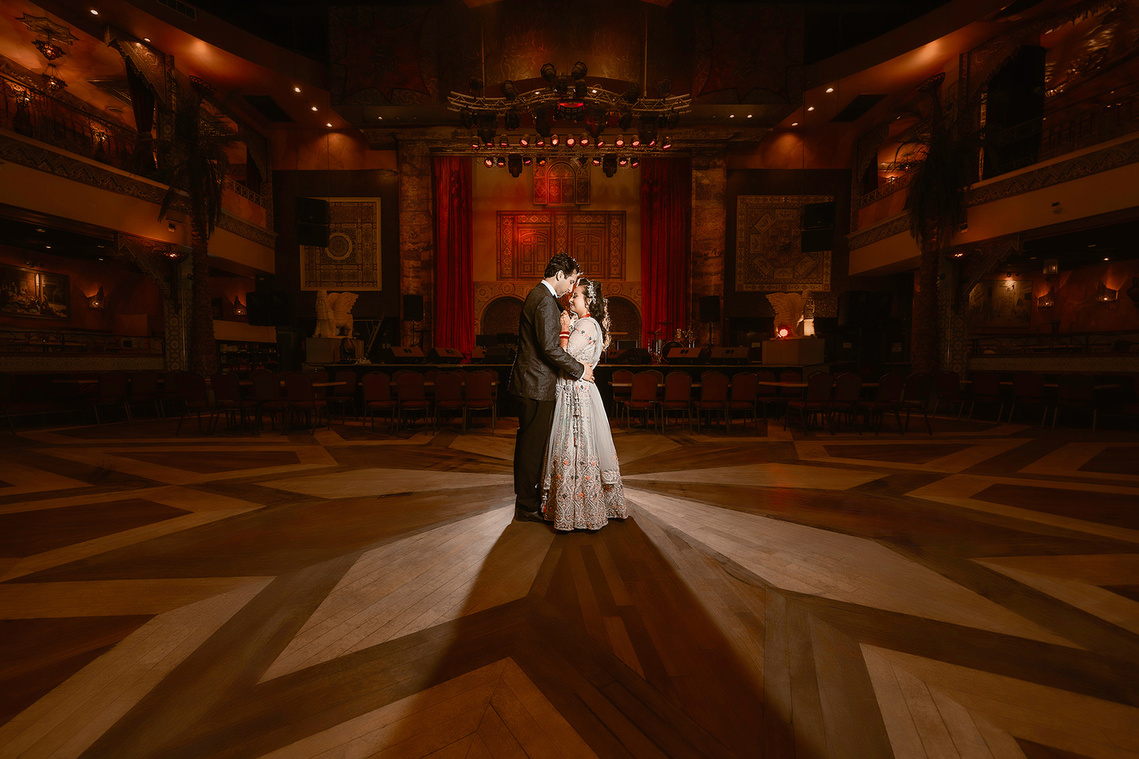 A beautiful moment captured during the first dance featuring the bride and groom sharing a loving embrace during their wedding in Mequon, Wisconsin. 