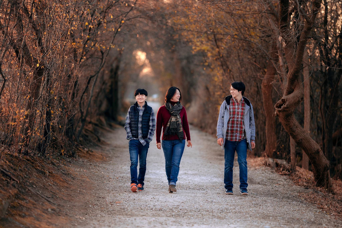 Beautiful walking shot a gorgeous family of three. Magnificent golden light and autumn colors. Great time to shoot family pictures here in Wisconsin.