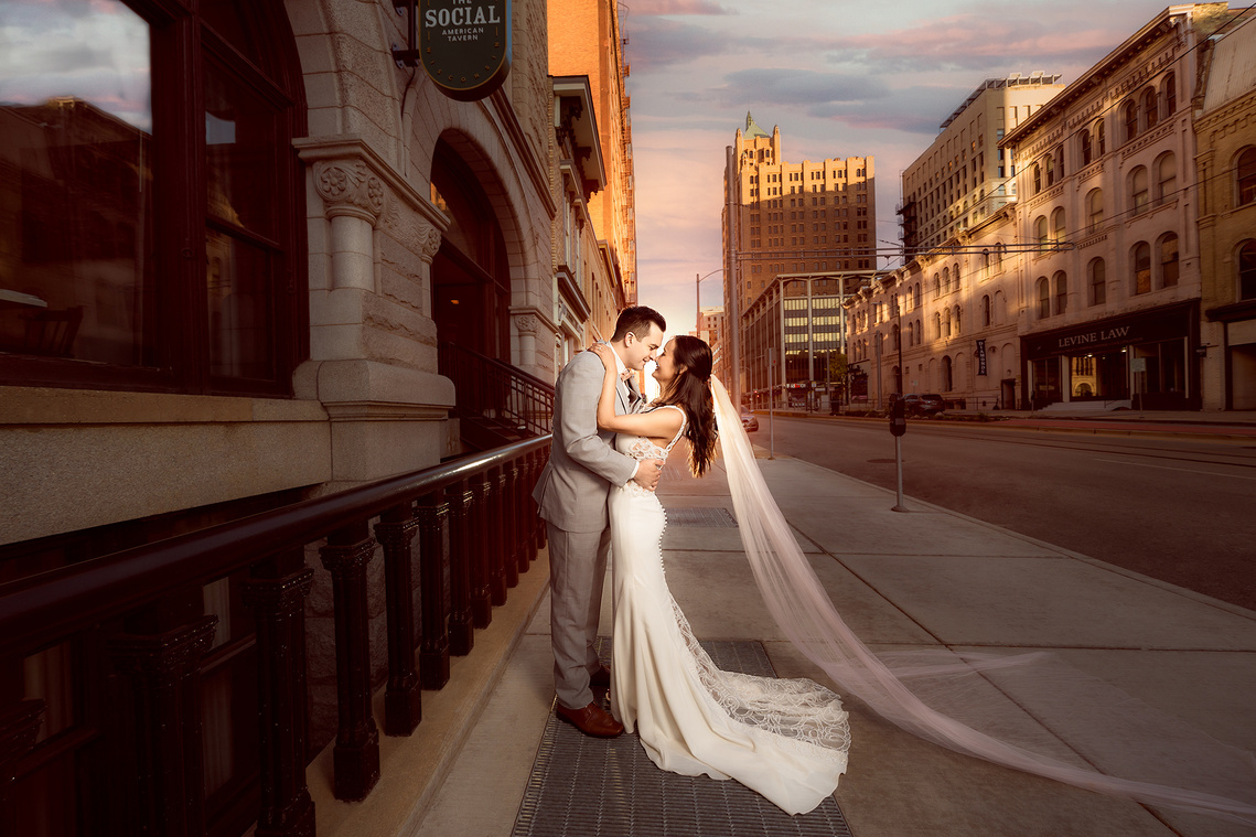 Bride and groom posing romantic for the best wedding picture on their special day in Milwaukee Wisconsin. 