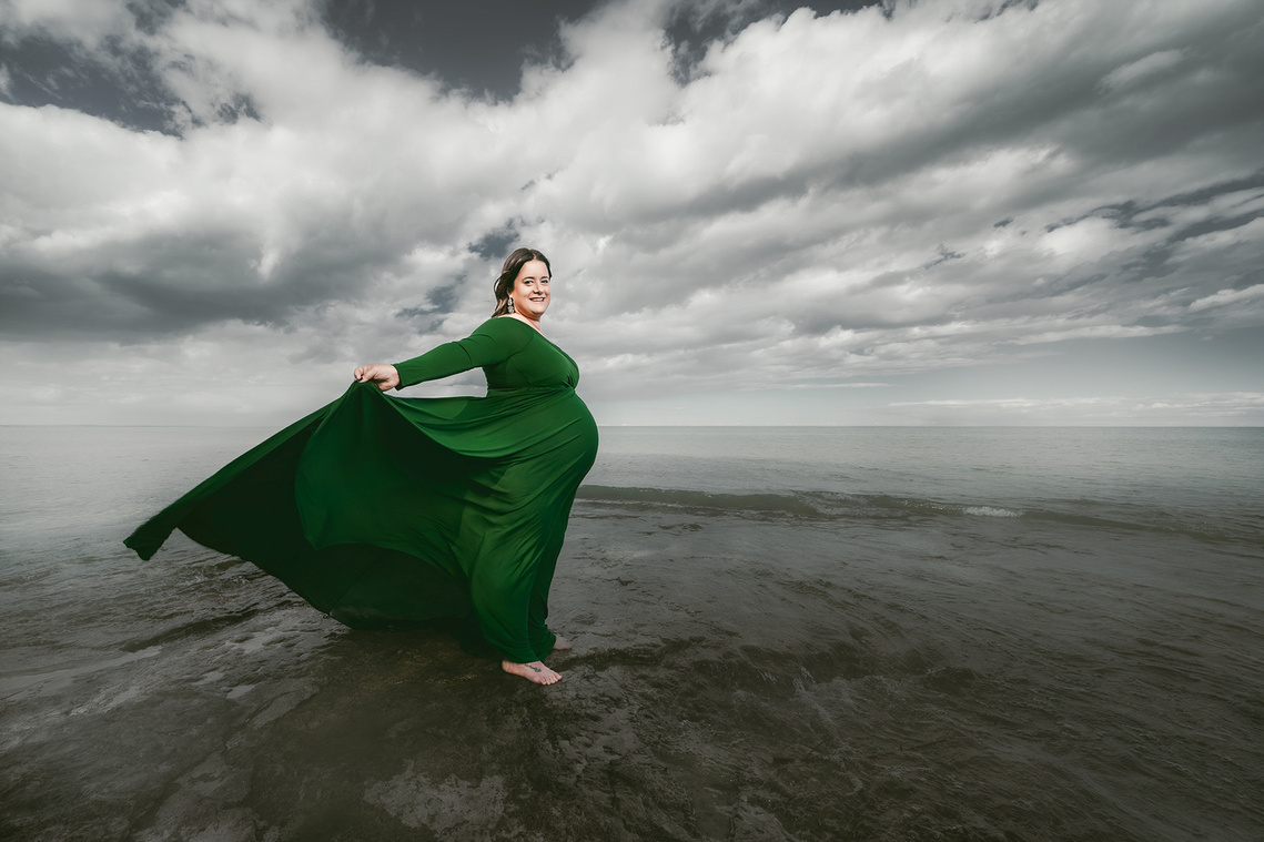 Stunning wide angle maternity photograph of a woman at Harrington Beach Wisconsin. Great filed of view. 