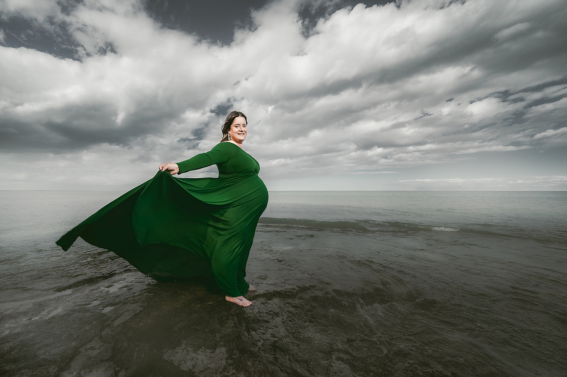 Stunning wide angle maternity photograph of a woman at Harrington Beach Wisconsin. Great filed of view. 