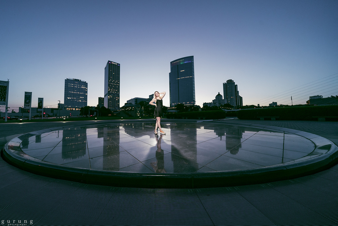 A young girl embracing her pose in the heat of Down Town Milwaukee in her photoshoot. Milwaukee Wisconsin portrait photography. 