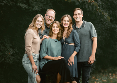 Stunning family picture of five in West Bend Wisconsin. Classic group pose featuring a happy family picture. 