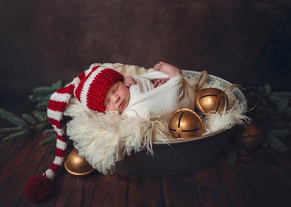 Adorable cute newborn baby. Christmas themed newborn photoshoot in Mequon Wisconsin.