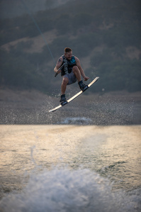 Person jumps while wakeboarding.