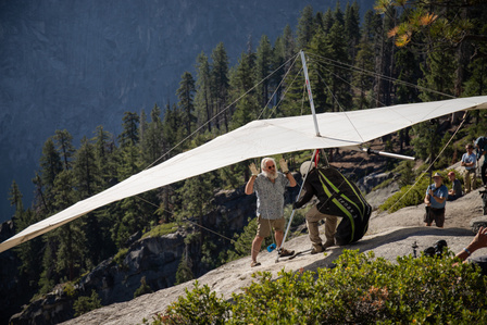 A hang glider prepares for his descent on top of Glacier Point in Yosemite.