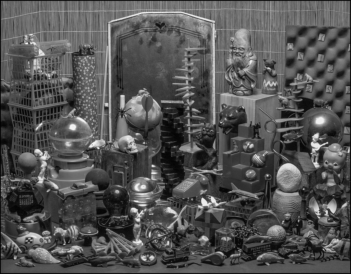 Lao Tse and Sancho Puerco Visit the Museum of Toys, or Toy Museum for short. A more traditionally-composed still life, with a great many toys and other objects arranged on a table top.