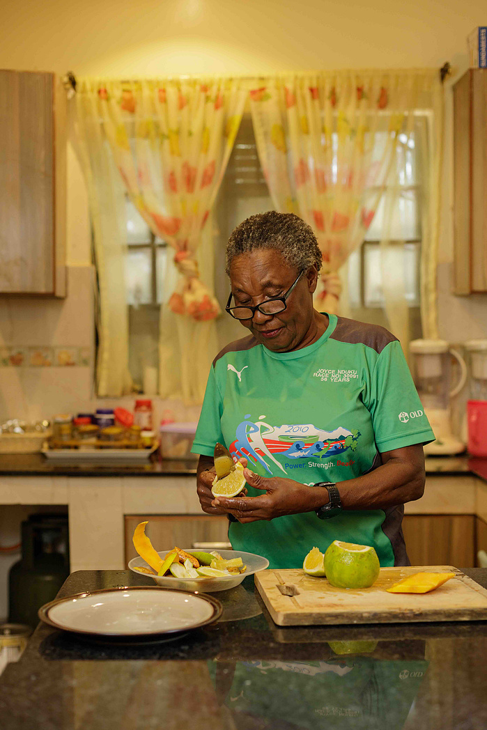Joyce Nduku. Tata Marathoner prepares some fruits at her home in Athi River Nairobi
