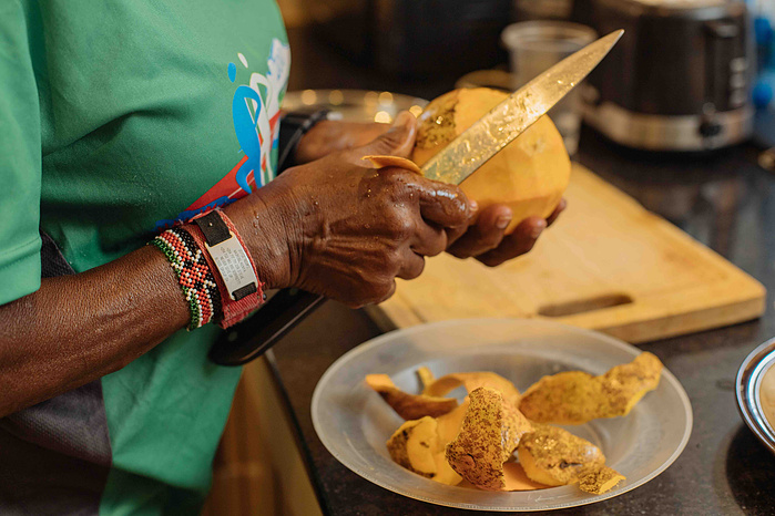 Joyce Nduku. Tata Marathoner prepares some fruits at her home in Athi River Nairobi 