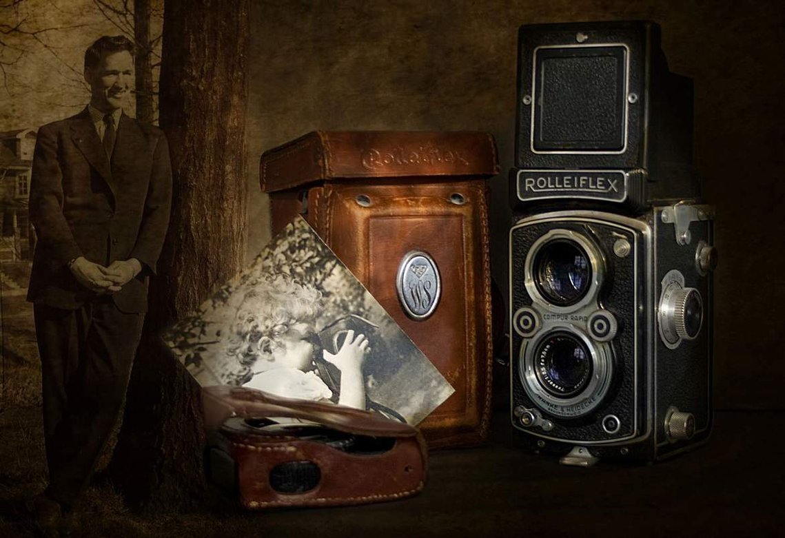 Still life image with Bill Sparrow and old Rolleiflex camera.