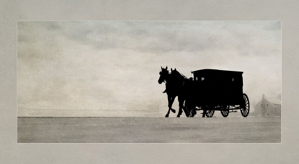 A silhouette of a Mennonite horse and buggy on the way home from church in Waterloo, Ontario