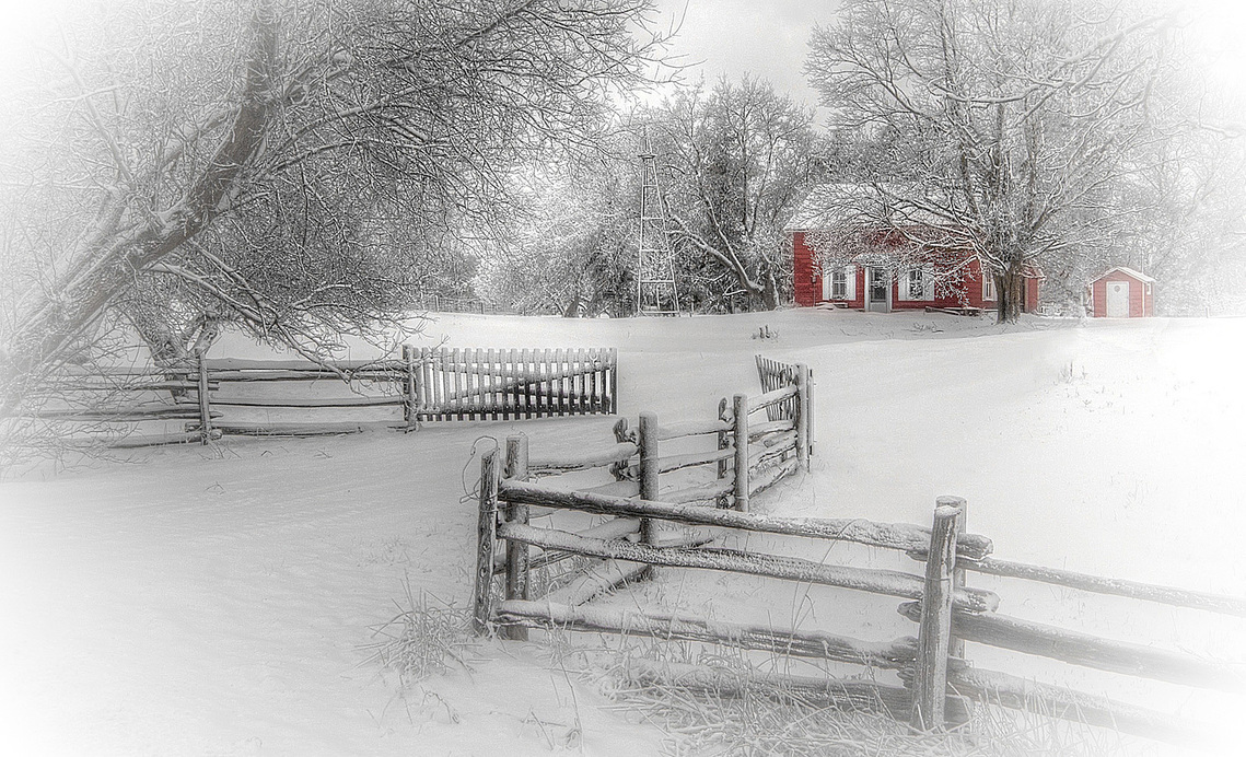 Red farmhouse during a blizzard in Cheltenham, Ontario