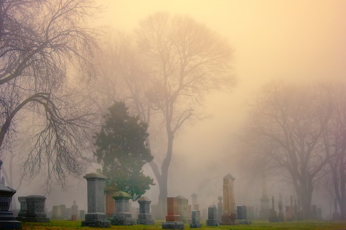 View of cemetery on foggy day in Hamilton, Ontario.