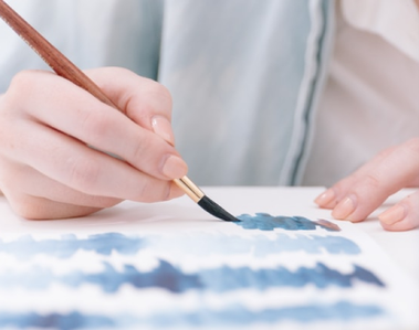 Painting watercolor and being creative.