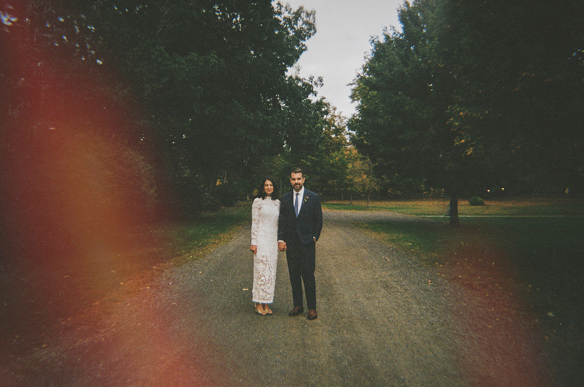 Cool couple standing together in the Hudson Valley, captured on color film. A modern yet timeless moment—rich tones, natural light, and effortless style, perfect for couples who want wedding photography with edge and authenticity.