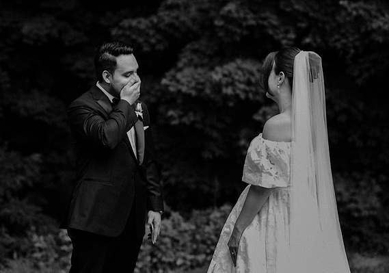 First look between Bride and Groom. Groom is speechless and overwhelmed with emotion. Black and White Photo