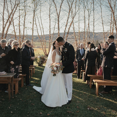 Color photo of wedding ceremony in the Hudson Valley, Kissing.