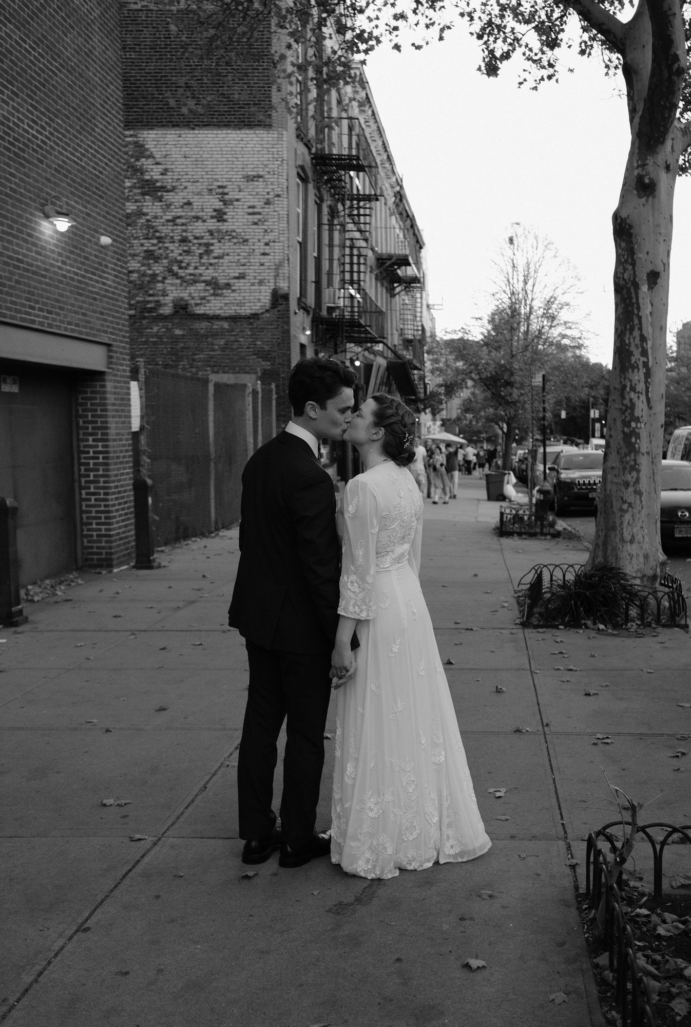 Wedding Couple walking down the street in Brooklyn, New York. Hudson Valley Wedding Photographers capture the moment.