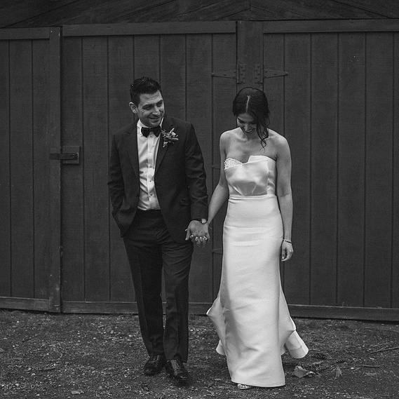 Wedding couple holding hands at the beautiful Foxfire Mountain House, Mt Temper, New York. Photographed by Hudson Valley Wedding Photographer.