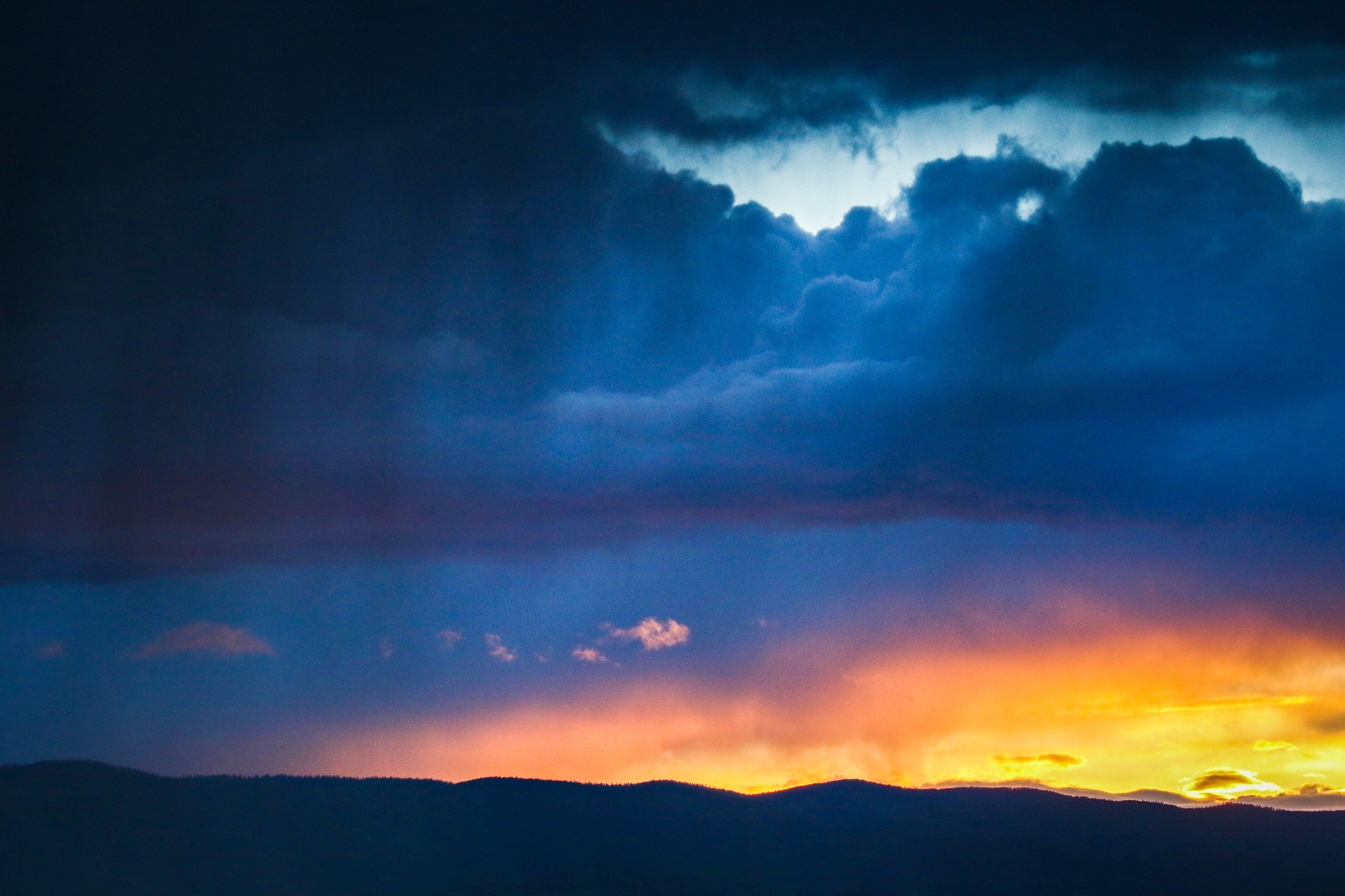 An evening rainstorm rolls across the Flathead Valley as seen from Highway 93 north of Kalispell on June 19, 2019. Hunter D’Antuono | Flathead Beacon