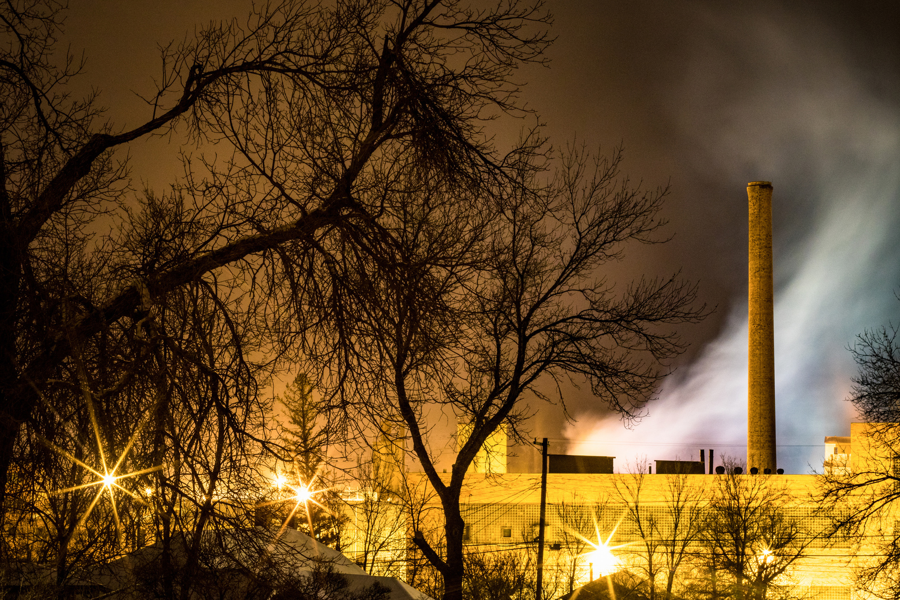 Exhaust from diesel-fueled train engines drifts into the frigid air above the rail yard in Livingston, Montana on February, 9 2018.