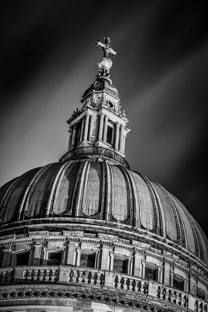 A long exposure black and white photo of The dome of St. Pauls at night by Mark Burley