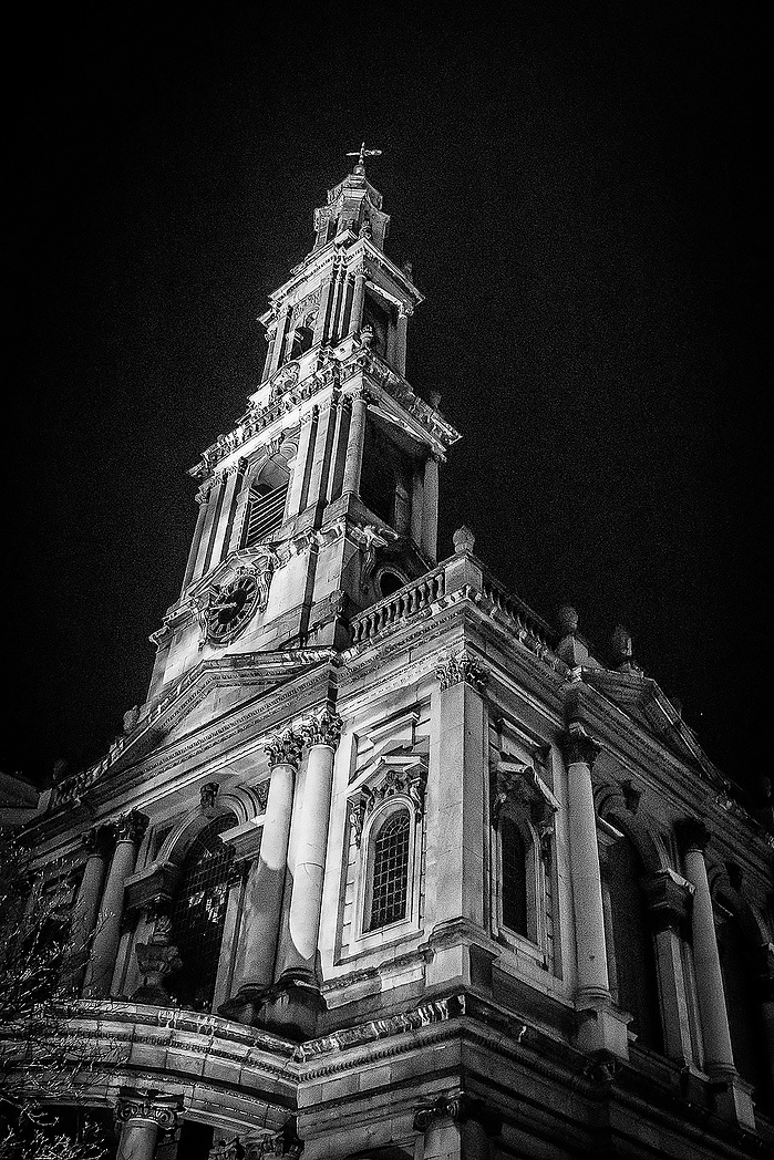 A night-time black and white photo of The City by Mark Burley