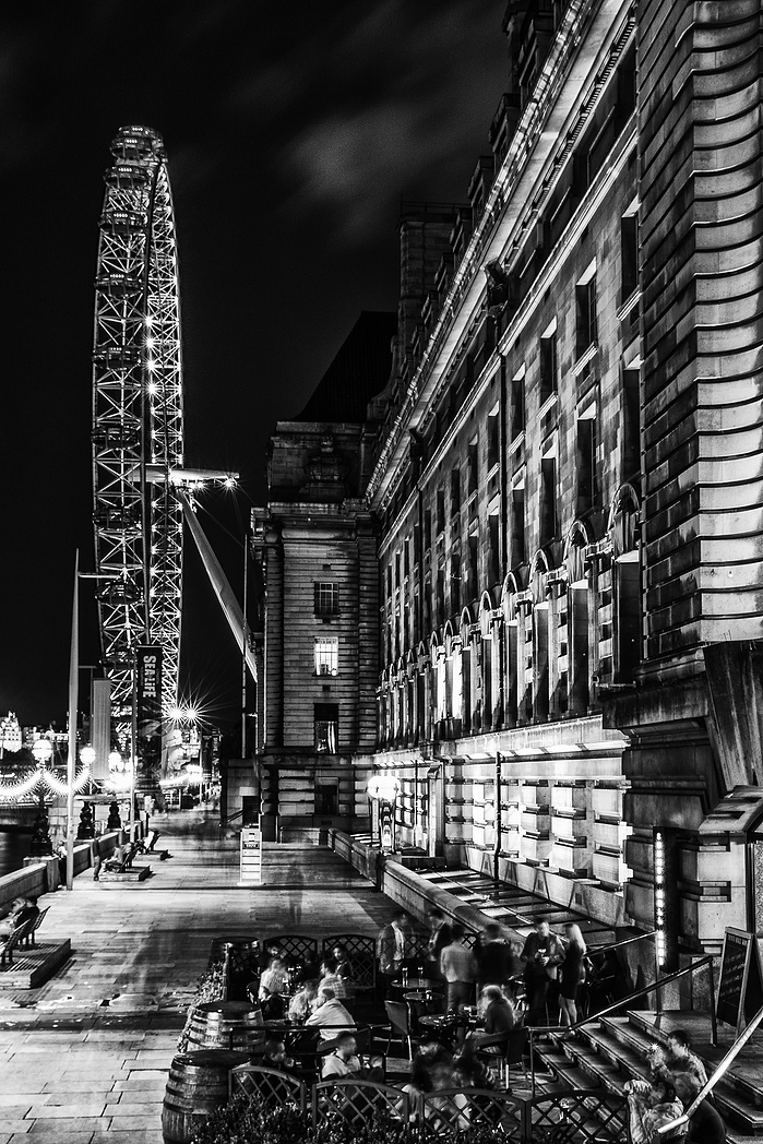A long exposure black and white photo of The Wheel at night by Mark Burley