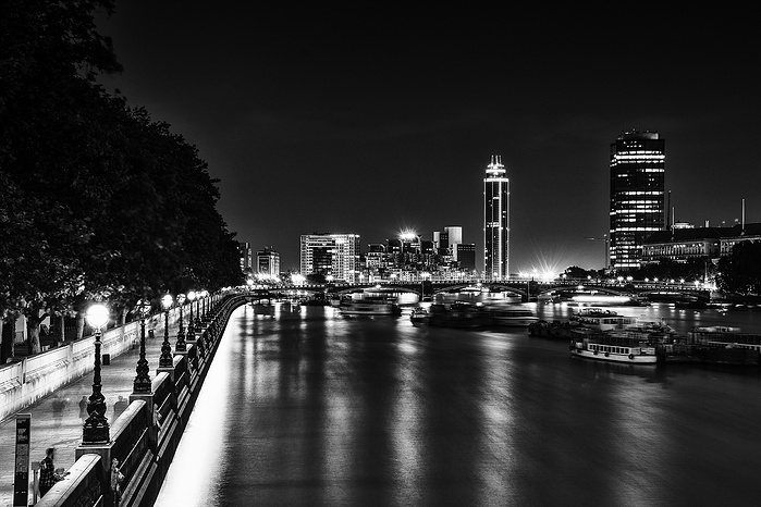 A black and white photo of The Thames at night by Mark Burley