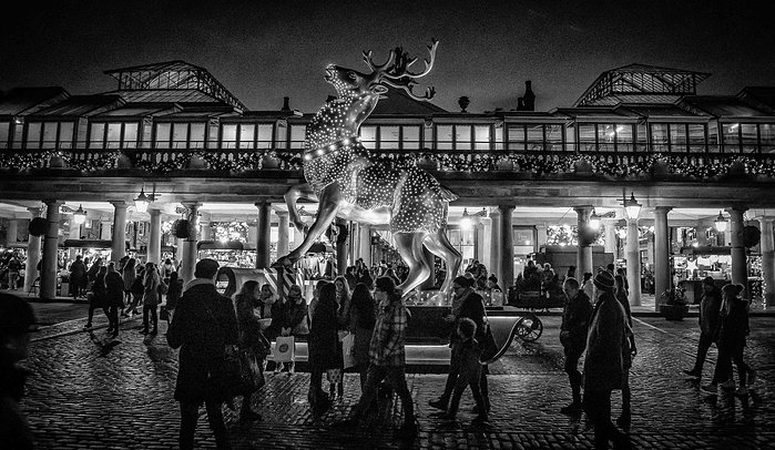 A black and white photo of Covent Garden at Christmas by Mark Burley