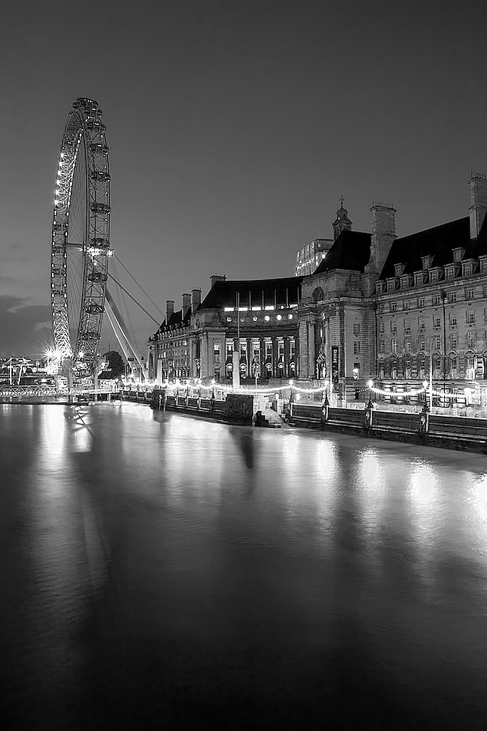 A long exposure black and white photo of The Wheel at night by Mark Burley